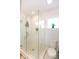 Beautiful glass shower features a window, white subway tile and sleek fixtures at 22 1/2 Mary St # A B C, Charleston, SC 29403