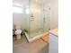 Modern bathroom featuring a glass-enclosed shower, tiled walls, and contemporary fixtures, offering style and comfort at 22 1/2 Mary St # A B C, Charleston, SC 29403