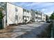 Charleston style row houses with covered porches and parking area at 22 1/2 Mary St # A B C, Charleston, SC 29403