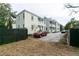 View of Charleston style row houses with covered porches and parking at 22 1/2 Mary St # A B C, Charleston, SC 29403