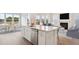 Modern kitchen with an island featuring a sink, white cabinets, stainless steel appliances and bar stool seating at 230 Denham St, Summerville, SC 29486