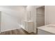 Well-lit bathroom featuring double vanity and access to a walk-in closet with wire shelving at 287 Blue Haw Dr, Moncks Corner, SC 29461