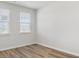 Cozy bedroom with hardwood floors and plenty of natural light from two windows at 287 Blue Haw Dr, Moncks Corner, SC 29461