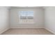 Bright bedroom featuring neutral carpet and a window with white blinds at 287 Blue Haw Dr, Moncks Corner, SC 29461