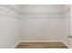 Walk-in closet with wire shelving and wood-look flooring at 287 Blue Haw Dr, Moncks Corner, SC 29461