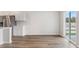 Dining Area featuring wood-look flooring, white cabinets with view to sliding glass doors leading outside at 287 Blue Haw Dr, Moncks Corner, SC 29461