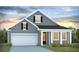 Charming single Gathering home with a two-car garage and attractive exterior, set against a beautiful sunset backdrop at 287 Blue Haw Dr, Moncks Corner, SC 29461