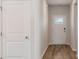 Bright entryway showcasing the hallway, a closet door, and wood-look flooring at 287 Blue Haw Dr, Moncks Corner, SC 29461