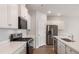 Modern kitchen featuring stainless steel appliances, quartz countertops, white cabinets, and wood-look flooring at 287 Blue Haw Dr, Moncks Corner, SC 29461
