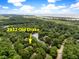 Aerial view of the neighborhood including trees, roads, and the Intercoastal Waterway at 2932 Old Drake Dr, Seabrook Island, SC 29455