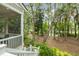 The back porch with steps offers picturesque backyard views overlooking tranquil waterfront and lush landscaping at 2932 Old Drake Dr, Seabrook Island, SC 29455