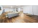 The finished basement has sleek LVP flooring, a couch, and an open floor plan at 2932 Old Drake Dr, Seabrook Island, SC 29455