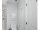 A modern bathroom featuring a toilet, sink, shower, and tiled walls at 2932 Old Drake Dr, Seabrook Island, SC 29455