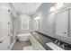 Well-lit bathroom features a standalone tub, shower, and modern and sinks at 2932 Old Drake Dr, Seabrook Island, SC 29455
