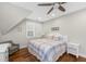Bedroom with white furniture, ceiling fan, and two windows at 2932 Old Drake Dr, Seabrook Island, SC 29455
