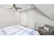 Cozy bedroom features hardwood floors, ceiling fan, and closet at 2932 Old Drake Dr, Seabrook Island, SC 29455