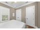 Bedroom with hardwood floors, shutters, neutral walls, and white doors offer a serene retreat at 2932 Old Drake Dr, Seabrook Island, SC 29455