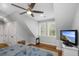 Neutral colored bedroom featuring hardwood floors, ceiling fan, and ample natural light at 2932 Old Drake Dr, Seabrook Island, SC 29455