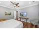 Comfortable bedroom with hardwood floors, a ceiling fan, and a mounted television at 2932 Old Drake Dr, Seabrook Island, SC 29455