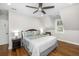 Inviting bedroom with ceiling fan, wood floors, and bedside lamps at 2932 Old Drake Dr, Seabrook Island, SC 29455
