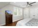 Bedroom features a comfortable bed, a ceiling fan, and plenty of natural light at 2932 Old Drake Dr, Seabrook Island, SC 29455