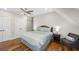 Cozy bedroom with ceiling fan, soft lighting, and wood flooring at 2932 Old Drake Dr, Seabrook Island, SC 29455