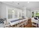Bright dining area with large windows and white dining set at 2932 Old Drake Dr, Seabrook Island, SC 29455