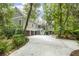 Stately coastal home with multi-car garage, elevated porch, and lush, mature landscaping at 2932 Old Drake Dr, Seabrook Island, SC 29455