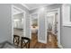 Hallway featuring hardwood floors, a view into the bedroom, and a bathroom at 2932 Old Drake Dr, Seabrook Island, SC 29455