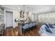 Open kitchen and living area featuring a spacious island, hardwood floors, and neutral color palette at 2932 Old Drake Dr, Seabrook Island, SC 29455