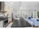 Gourmet kitchen featuring stainless steel appliances and a large island at 2932 Old Drake Dr, Seabrook Island, SC 29455