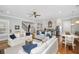 Open concept living room with staircase and full kitchen at 2932 Old Drake Dr, Seabrook Island, SC 29455