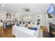 Spacious living room with ceiling fan and open kitchen at 2932 Old Drake Dr, Seabrook Island, SC 29455