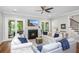 Comfortable living room with fireplace and sliding glass doors to a porch at 2932 Old Drake Dr, Seabrook Island, SC 29455