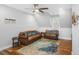 Bright living room features hardwood floors, stylish furniture, ceiling fan, and beach decor at 2932 Old Drake Dr, Seabrook Island, SC 29455