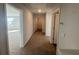Neutral hallway with carpet and white doors leading to other rooms at 306 Blue Haw Dr, Moncks Corner, SC 29461