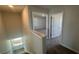 Second floor hallway showcasing bedroom entrances and staircase at 306 Blue Haw Dr, Moncks Corner, SC 29461