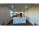 Bright kitchen with white cabinets, island, and stainless steel appliances at 306 Blue Haw Dr, Moncks Corner, SC 29461