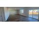 Bright and airy living area with sliding glass doors and hardwood floors at 306 Blue Haw Dr, Moncks Corner, SC 29461