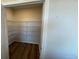 Spacious pantry with wood floors and ample storage shelving space at 306 Blue Haw Dr, Moncks Corner, SC 29461