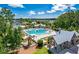 Breathtaking aerial view of the community pool, playground, and surrounding homes nestled among mature trees at 3713 Maidstone Dr, Mount Pleasant, SC 29466