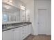 Bright bathroom with dual sink vanity, granite countertops, and a glass shower enclosure at 3713 Maidstone Dr, Mount Pleasant, SC 29466