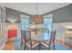 Well-lit dining room with board and batten walls, stylish lighting fixture, and modern decor at 3713 Maidstone Dr, Mount Pleasant, SC 29466