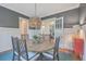 A sunlit dining room featuring a round table, stylish chairs, and hardwood floors at 3713 Maidstone Dr, Mount Pleasant, SC 29466