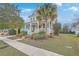 Inviting yellow home with a charming front porch and well-maintained landscaping on a sunny day at 3713 Maidstone Dr, Mount Pleasant, SC 29466
