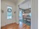 Bright foyer with hardwood floors leading to a dining room with stylish decor and natural light at 3713 Maidstone Dr, Mount Pleasant, SC 29466