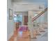 Welcoming foyer with hardwood floors, staircase, and open layout leading to the living and dining areas at 3713 Maidstone Dr, Mount Pleasant, SC 29466