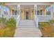 Inviting front porch with white railings and detailed trim, leading to the front door of a charming home at 3713 Maidstone Dr, Mount Pleasant, SC 29466