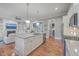 Open concept kitchen featuring a large island, stainless steel appliances, and hardwood floors at 3713 Maidstone Dr, Mount Pleasant, SC 29466