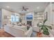 Bright living room features built-in shelving, fireplace, plush seating, and hardwood floors at 3713 Maidstone Dr, Mount Pleasant, SC 29466